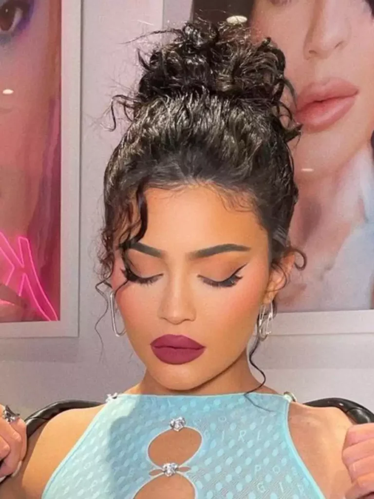 Kylie Jenner's Messy Bun with Face-Framing Strands